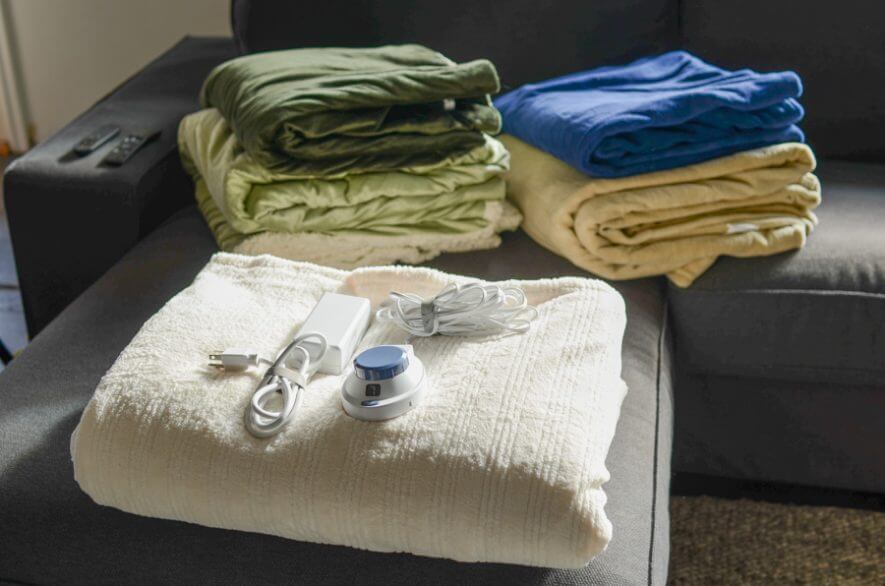 group of electric blankets on couch